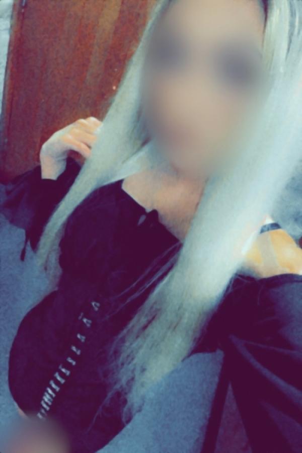 Ella taking a selfie in a black dress 